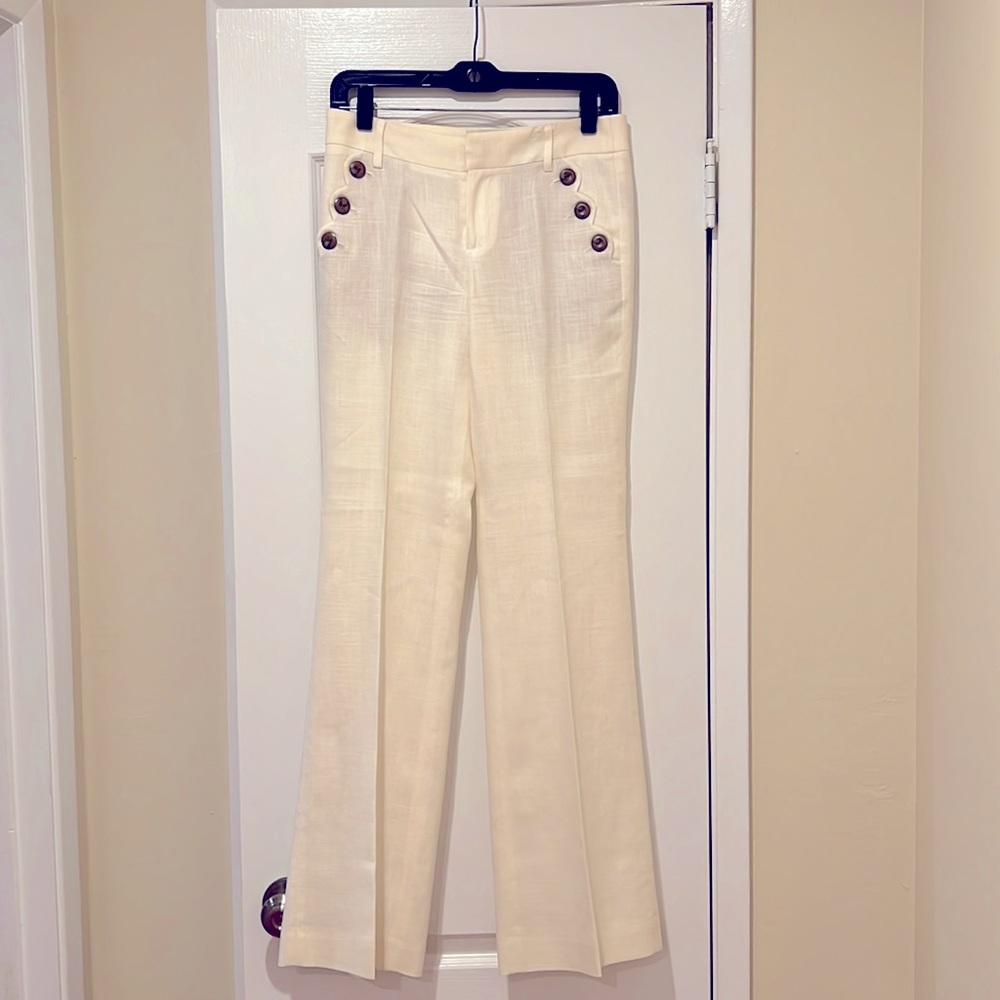 Anthropologie white linen pants with buttons. Hardly worn & in great condition.